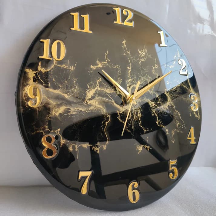 Black vastu wall clock with golden blast design