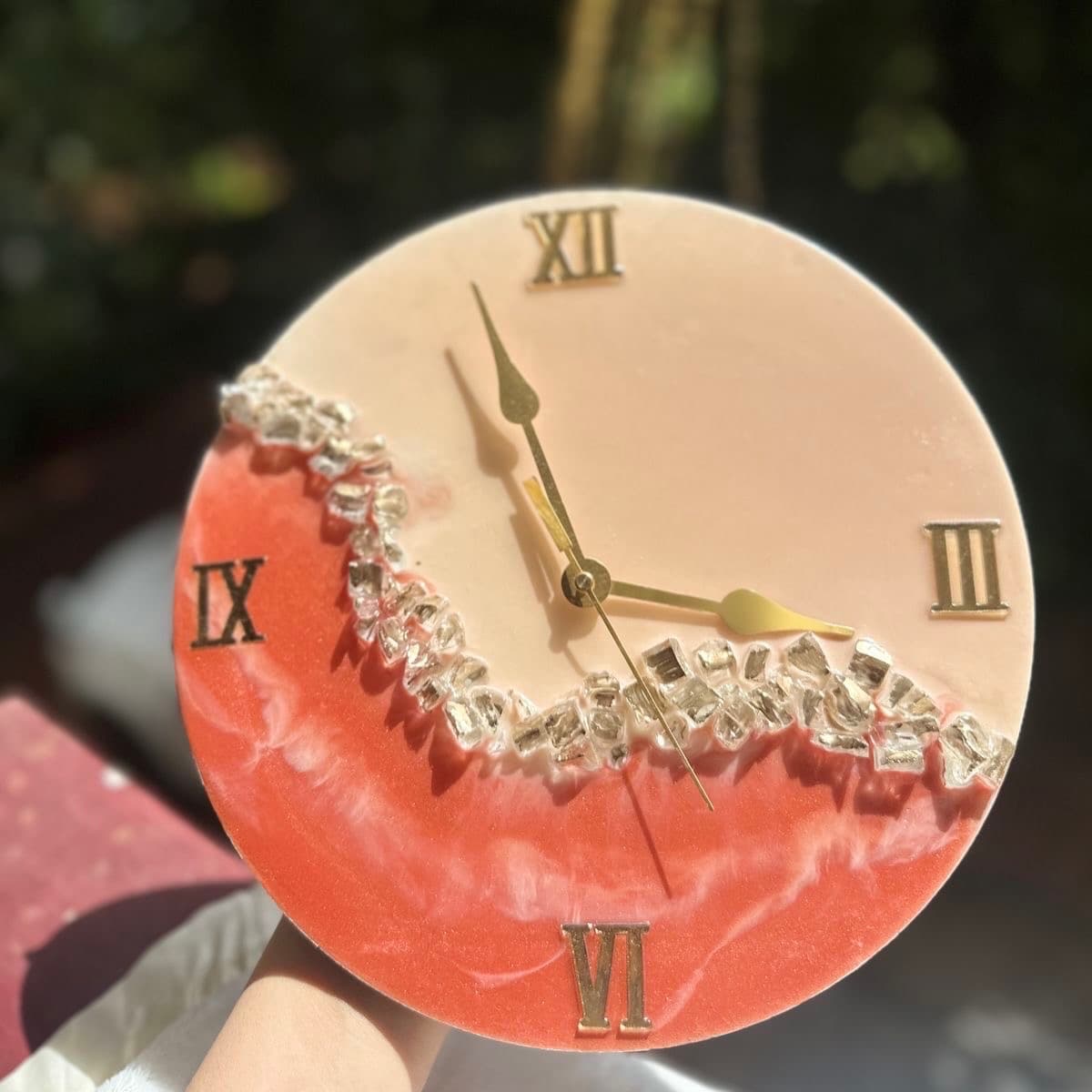 Orange resin wall clock styled in elegant living room