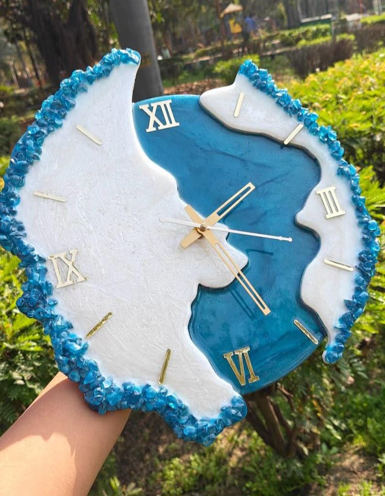 Azure Crystal luxury sky blue resin wall clock with crystal stone border, gold Roman numerals and silent movement