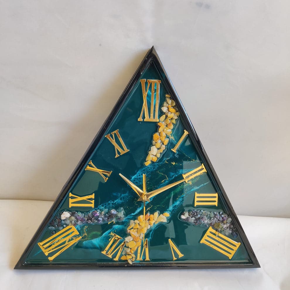 Detail of golden roman numerals on luxury handmade resin clock